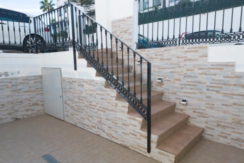 Semi-Detached-Townhouse-3-Bedroom-in-Alhaurin-Golf-view-stairs-front-entrance-day-Magnificasa